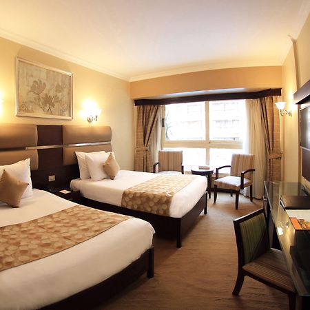 Pyramisa Suites Hotel Cairo Giza Luaran gambar A room at the hotel